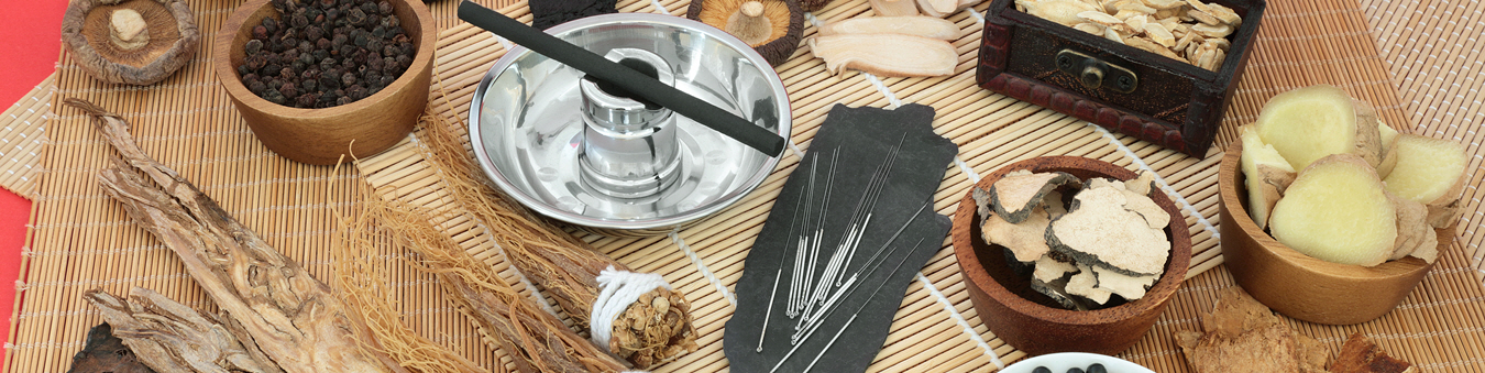 Image of the tools of Traditional Chinese Medicine, herbs, acupuncture needles, and other various equipment